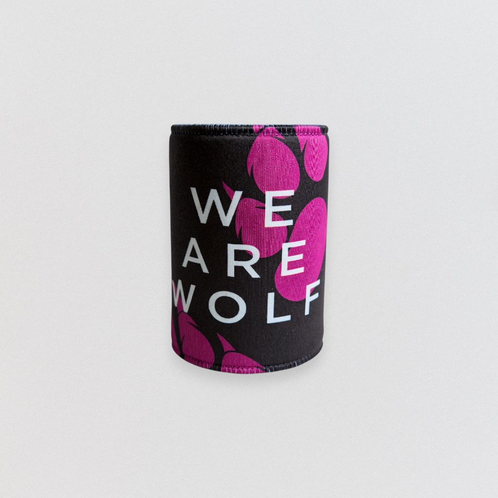 Black can cooler with pink wolf designs and 'WE ARE WOLF' text on a light gray background