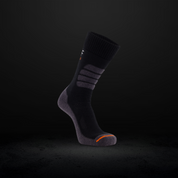 Black work sock with orange accents on a dark background